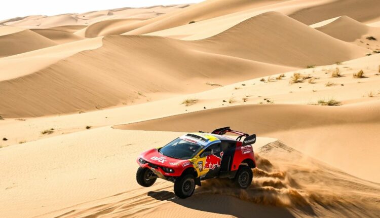 Sebastien Loeb Climbs Standing after Winning Dramatic Battle with Rally Leader Yazeed Al Rajhji